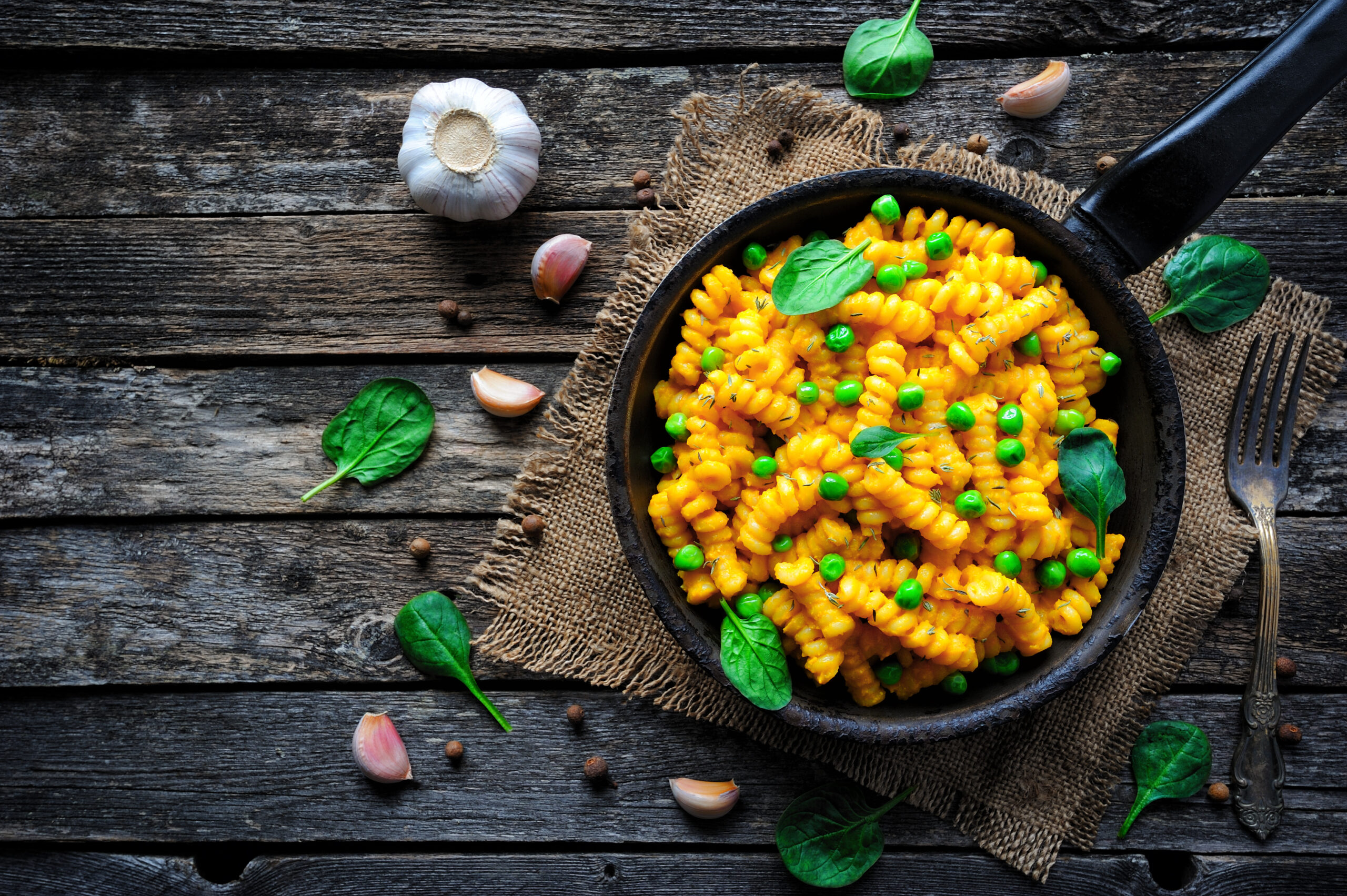 Vegan Mac and Cheese with green peas. Clean eating, plant based food concept